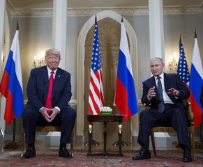 Russian President Vladimir Putin, right, makes a statement as U.S. President Donald Trump, left, looks on at the beginning of a meeting at the Presidential Palace in Helsinki, Finland, Monday, July 16, 2018. (AP Photo/Pablo Martinez Monsivais)