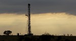 FILE - This May 9, 2012 file photo shows a drilling rig near Kennedy, Texas. Oil companies are finding new ways to export growing amounts of oil from the U.S. despite restrictions on exporting crude.