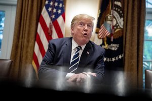 President Donald Trump speaks to members of the media as he meets with members of Congress in the Cabinet Room of the White House, Tuesday, July 17, 2018, in Washington.