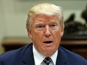 President Donald Trump speaks while having lunch with services members in the Roosevelt Room of the White House in Washington, Tuesday, July 18, 2017.