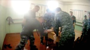 In this video grab provided by the Russian independent newspaper Novaya Gazeta on Wednesday, July 26, 2018, a prisoner is beaten while handcuffed at the prison in Yaroslavl, Russia, about 270 kilometers (169 miles) north-east of Moscow.