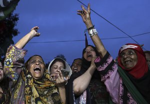 Supporters of Pakistan Peoples Party protest against Pakistan Election Commission for delaying the announcement of election results, in Karachi, Pakistan, Thursday, July 26, 2018.