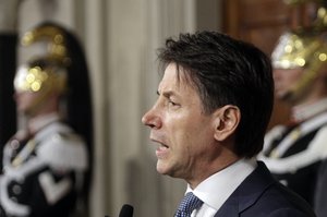 Giuseppe Conte addresses the media after meeting Italian President Sergio Mattarella, at the Quirinale presidential palace in Rome