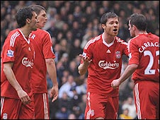 Liverpool defender Jamie Carragher (right) is restrained by Xabi Alonso (second right) after a spat with Alvaro Arbeloa (left)