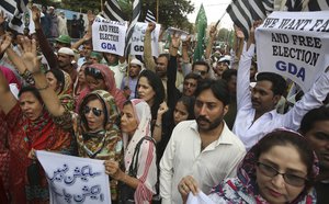 Supporters of Pakistani political party Grand Democratic Alliance (GDA) protest the results of the recently concluded general elections, Friday, Aug. 3, 2018.