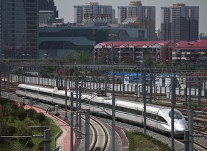 A CRH high-speed train leaves the South Train Station in Beijing, China, Tuesday, July 26, 2011. The Chinese government on Tuesday ordered a two-month, nationwide safety campaign for its railway system after a collision between two bullet trains killed at least 39 on last Saturday. (AP Photo/Andy Wong)