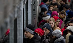 Tourists queue to enter the Anne Frank House in Amsterdam, Netherlands, Thursday, Dec. 7, 2017.