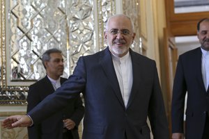 Iranian Foreign Minister Mohammad Javad Zarif arrives for a meeting with his North Korean counterpart Ri Yong Ho in Tehran, Iran, Tuesday, Aug. 7, 2018.