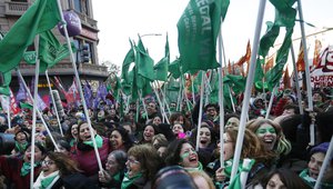 Women celebrate has been approved abortion legalization law, near Argentina's congress in Buenos Aires, Thursday, June 14, 2018.