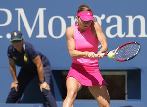 NEW YORK, NY - AUGUST 25:  Simona Halep of Romania returns a shot against Danielle Rose Collins of the USAduring the US Open at the USTA Billie Jean King National Tennis Center in New York, New York on August 25, 2014. Photo By Aaron Gilbert / Retna Ltd.