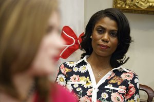 FILE - In this Feb. 14, 2017, file photo, Omarosa Manigault-Newman, then an aide to President Donald Trump, watches during a meeting with parents and teachers in the Roosevelt Room of the White House in Washington.