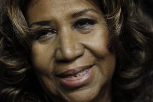 Aretha Franklin smiles after the Detroit Pistons-Miami Heat NBA basketball game in Auburn Hills, Mich.