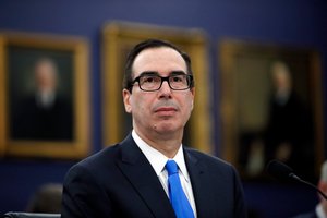 Treasury Secretary Steve Mnuchin smiles as he testifies on the FY2019 budget