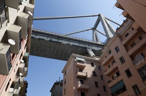 A view of part of the Morandi Bridge which is still standing as seen from evacuated housing buildings below, in Genoa, Italy, Thursday Aug. 16, 2018.