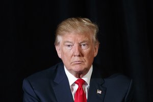 Republican presidential candidate Donald Trump listens to a question during a town hall with the Retired American Warriors, Monday, Oct. 3, 2016, in Herndon, Va.