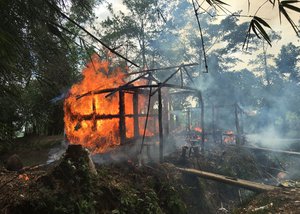 Houses are on fire in Gawdu Zara village, northern Rakhine state, Myanmar that had been abandoned by Rohingya Muslims on Thursday, Sept. 7, 2017.