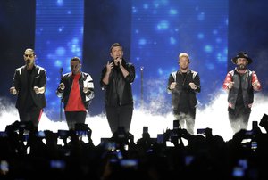 FILE - In this June 6, 2018 file photo, Kevin Richardson, Howie Dorough, Nick Carter, Brian Littrell, and AJ McLean of Backstreet Boys, perform "Don't go Breaking My Heart" at the CMT Music Awards at the Bridgestone Arena in Nashville, Tenn. Over a dozen people were injured, Saturday, Aug. 18 and transported to hospitals after trusses holding up the entrance to a resort where the Backstreet Boys were set to begin a concert in Oklahoma collapsed.