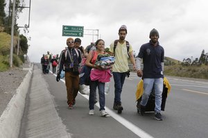 Venezuelans leave the Rumichaca Bridge despite they do not have a passport required by Ecuador's government . Rumichaca, Ecuador, Sunday, Aug. 19, 2018.