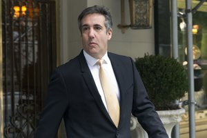 Michael Cohen, former personal lawyer to President Donald Trump, leaves his apartment building, in New York,  Tuesday, Aug. 21, 2018. Cohen could be charged before the end of the month with bank fraud in his dealings with the taxi industry and with committing other financial crimes, two people familiar with the federal probe said Monday. (AP Photo/Richard Drew)