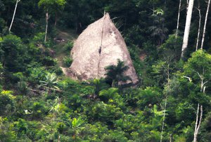 This 2017 photo released by the National Indian Foundation (FUNAI) shows a "maloca," or long house, in Vale do Javari, Amazonas state, Brazil.