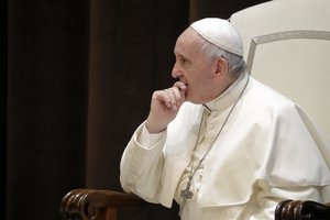 Pope Francis meets a group of children who traveled on a special train from Milan and arrived at St. Peter's station at the Vatican, Saturday, June 9, 2018 as part of an initiative to give children living in disadvantaged areas of the country a day of joy.