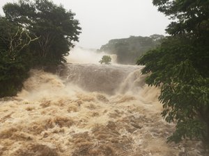 This photo provided by Jessica Henricks shows flooding Thursday, August 23, 2018, Wailuku River near Hilo, Hawaii.