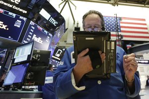 Trader Steven Kaplan works on the floor of the New York Stock Exchange, Wednesday, Aug. 22, 2018