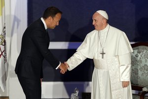 Pope Francis shakes hands with Irish Prime Minister Leo Varadkar as they meet, in Dublin, Ireland, Saturday, Aug. 25, 2018