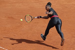 FILE - In this May 29, 2018 file photo, Serena Williams of the U.S. returns a shot against Krystyna Pliskova of the Czech Republic during their first round match of the French Open tennis tournament at the Roland Garros stadium in Paris.