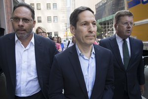 Thomas Frieden, center, leaves Brooklyn federal court, Friday, Aug. 24, 2018, in New York