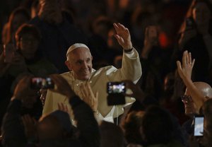 Pope Francis is cheered by the crowd during the Festival of Families in Croke Park Stadium in Dublin, Ireland, Saturday, Aug. 25, 2018. Pope Francis is on a two-day visit to Ireland.