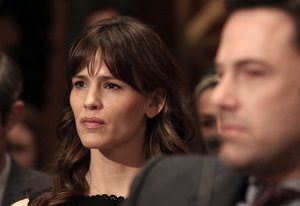 Actress Jennifer Garner listens to testimony on Capitol Hill in Washington - where her husband, Ben Affleck, right, testified