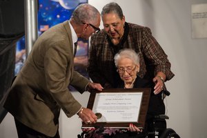 NASA Administrator Charles Bolden presents an award to Katherine Johnson, the African American mathematician, physicist, and space scientist, who calculated flight trajectories for John Glenn's first orbital flight in 1962, at a reception to honor members of the segregated West Area Computers division of Langley Research Center on Thursday, Dec. 1, 2016, at the Virginia Air and Space Center in Hampton, VA. Afterward, the guests attended a premiere of