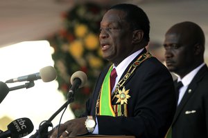 Zimbabwean President Emmerson Mnangagwa delivers his speech during his inauguration ceremony at the National Sports Stadium in Harare, Sunday, Aug. 26, 2018.