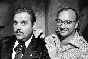 In this July 2, 1977, file photo, playwright Neil Simon, right, poses for a photo on the set of "The Cheap Detective" with Dom DeLuise.