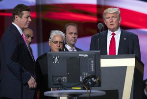 In this July 21, 2016, photo, then-Trump campaign manager Paul Manafort, left, and Manafort's chief deputy Rick Gates, center, watches as then-Republican presidential candidate Donald Trump rehearses for the Republican National Convention in Cleveland.