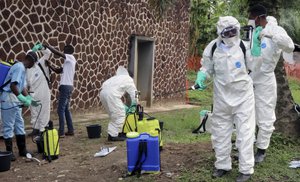 In this Thursday, May 31, 2018, file photo, Congolese health officials prepare to disinfect people and buildings at the general referral hospital in Mbandaka, Congo.