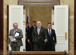 From left, Novolipetsk Steel Chairman Vladimir Lisin, Chief of Russia's Nanotechnology Agency Anatoly Chubais, back partly visible, Russian metals magnate Oleg Deripaska, back, and Russian Renova's CEO Viktor Vekselberg attend a meeting of Prime Minister Dmitry Medvedev with Russian businessmen in Moscow, Wednesday, July 10, 2013.