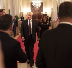 President Donald J. Trump and First Lady Melania Trump arrive to a dinner in celebration of evangelical leadership in the State Dining Room of the White House, August 27, 2018.