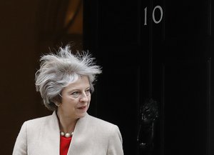 Britain's Prime Minister Theresa May looks out of 10 Downing Street as she wait for the arrival the Prime Minister of New Zealand Bill English at 10 Downing Street in London, Friday, Jan. 13, 2017.