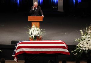 Former Vice President Joe Biden wipes a tear while giving a tribute during memorial service at North Phoenix Baptist Church for Sen. John McCain, R-Ariz. on Thursday, Aug. 30, 2018, in Phoenix.