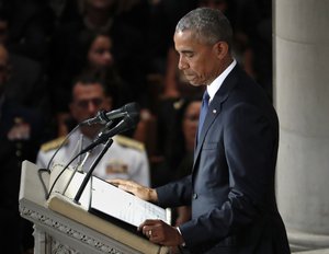 Former President Barack Obama pauses as he speaks at a memorial service for Sen. John McCain, R-Ariz., at Washington National Cathedral in Washington, Saturday, Sept. 1, 2018. McCain died Aug. 25, from brain cancer at age 81.