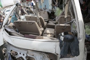 The clothes of a victim lie in the wreckage of a bus at the site of a deadly Saudi-led coalition airstrike on Thursday, in Saada, Yemen, Sunday, Aug. 12, 2018.