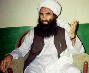 FILE- In this Aug. 22, 1998, file photo, Jalaluddin Haqqani, founder of the militant group the Haqqani network, speaks during an interview in Miram Shah, Pakistan.