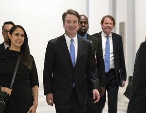 President Donald Trump's Supreme Court nominee, Judge Brett Kavanaugh, arrives to meet with Sen. Chris Coons, D-Del., a member of the Senate Judiciary Committee which will oversee his confirmation, on Capitol Hill in Washington, Thursday, Aug. 23, 2018.