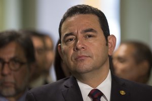 Guatemala's President Jimmy Morales listens as he gives a join press statement, alongside Nikki Haley, U.S. ambassador to the U.N., not in picture, at the National Palace of Culture in Guatemala City, Wednesday, Feb. 28, 2018.