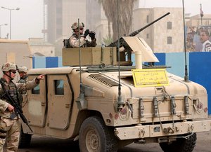 Soldiers from the 3rd Infantry Division set up a security perimeter near the International Zone in Baghdad, Iraq, after a suicide bomber detonated himself there July 14. A second suicide bomber was wounded by coalition forces and was unable to detonate hi