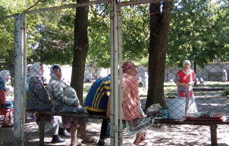 Women inside the fenced yard of the Svyatoshinsky psychiatric institution, Ukraine.