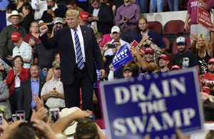 President Donald Trump gestures to the crowd as he finishes his speech at a rally in Billings, Mont., Thursday, Sept. 6, 2018.