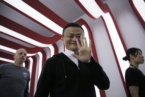 Alibaba Group Chairman Jack Ma gestures on the "Singles' Day" global online shopping festival in Shenzhen, southern China's Guangdong province Friday, Nov. 11, 2016.